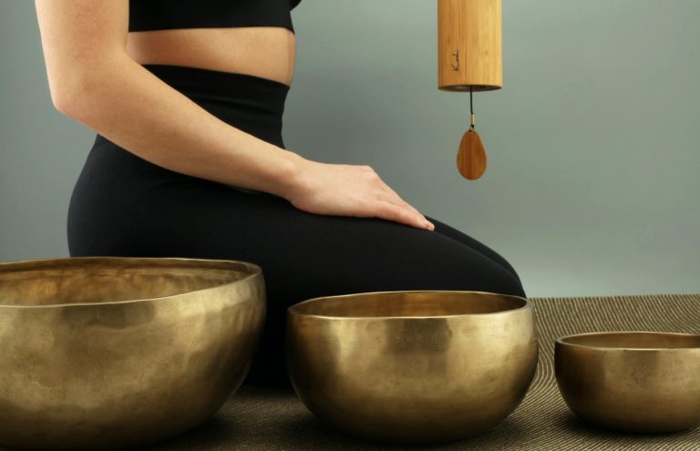 A tranquil scene featuring meditation with Tibetan singing bowls for relaxation and healing.
